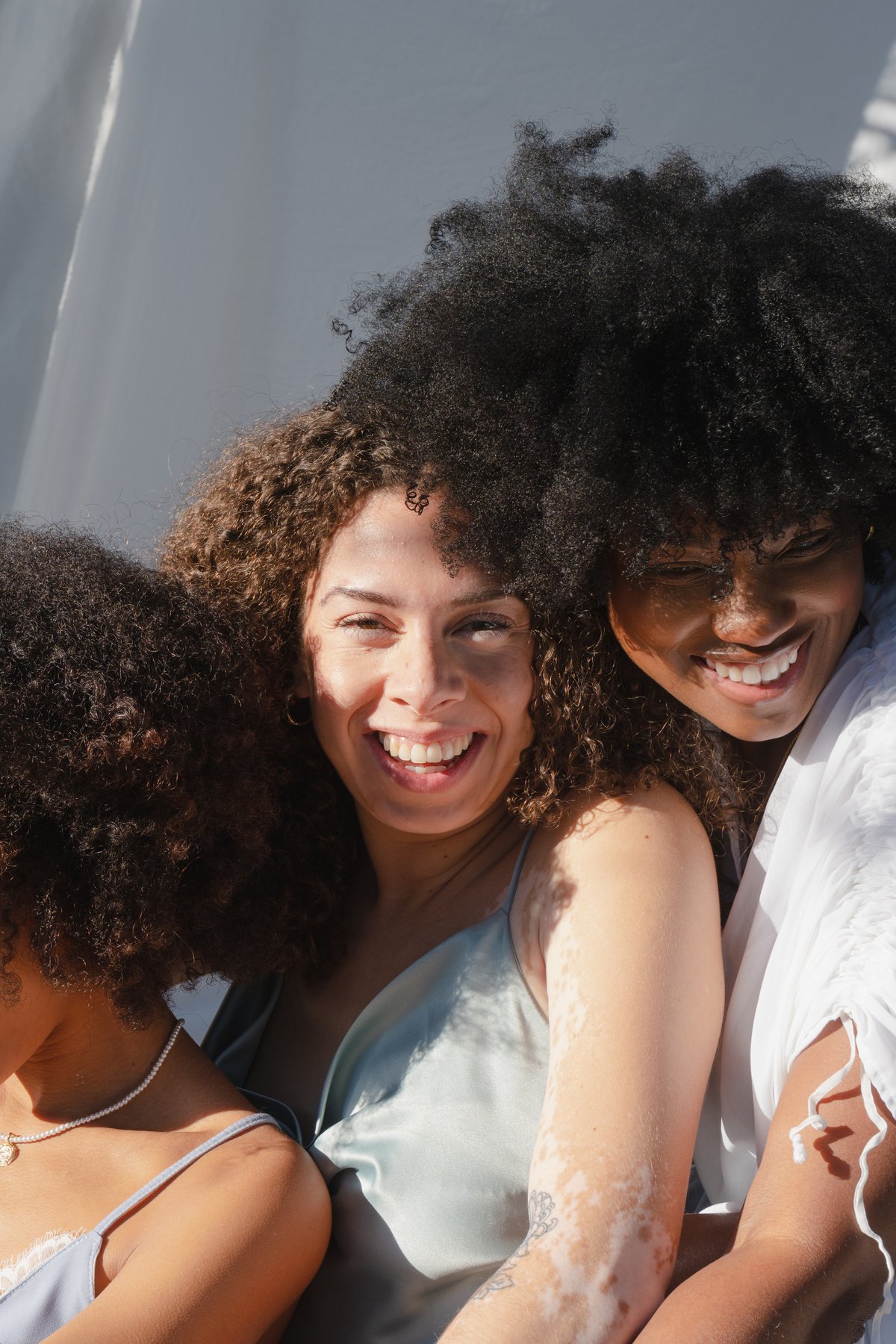 Women Posing with White Cloth in the Nature